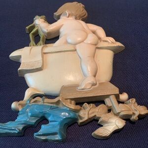 Cute wall hanging. The little boy getting in the tub with his frog 🐸